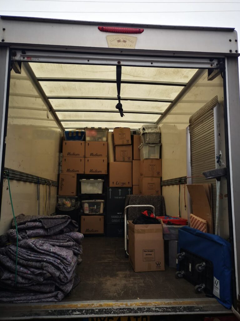 A large truck with boxes in it and other equipments on it