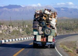 A truck with many items on the back of it.