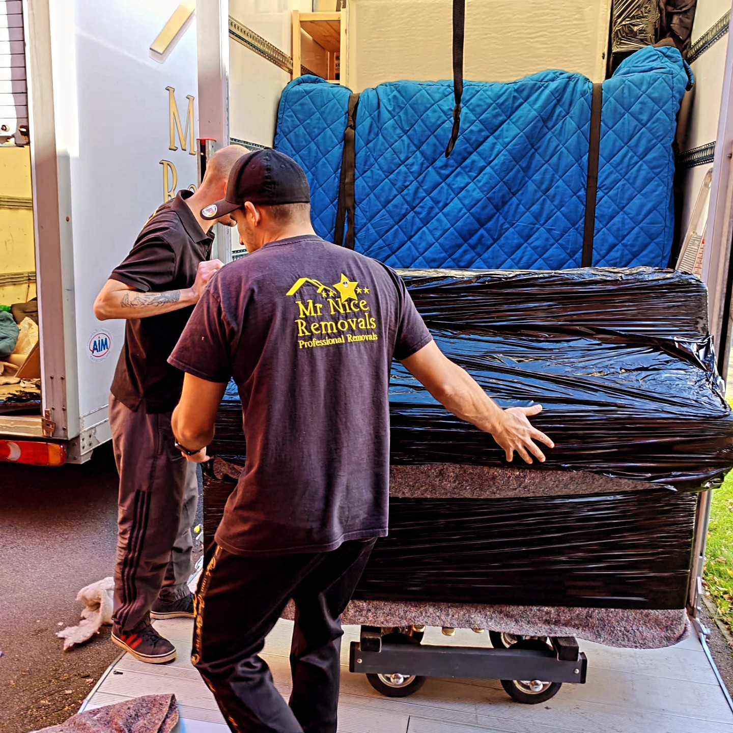 Mr Nice Removals team loading furniture into van